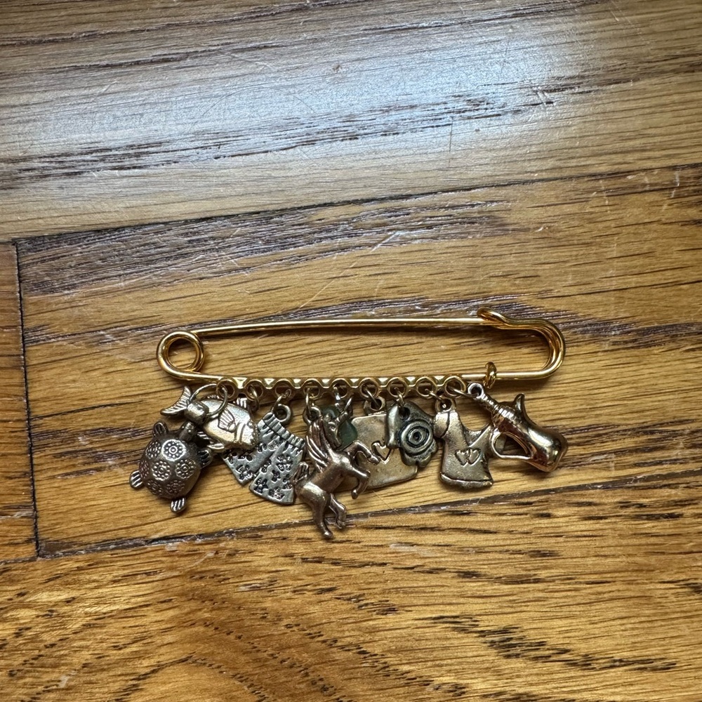 Gold Charm Brooch